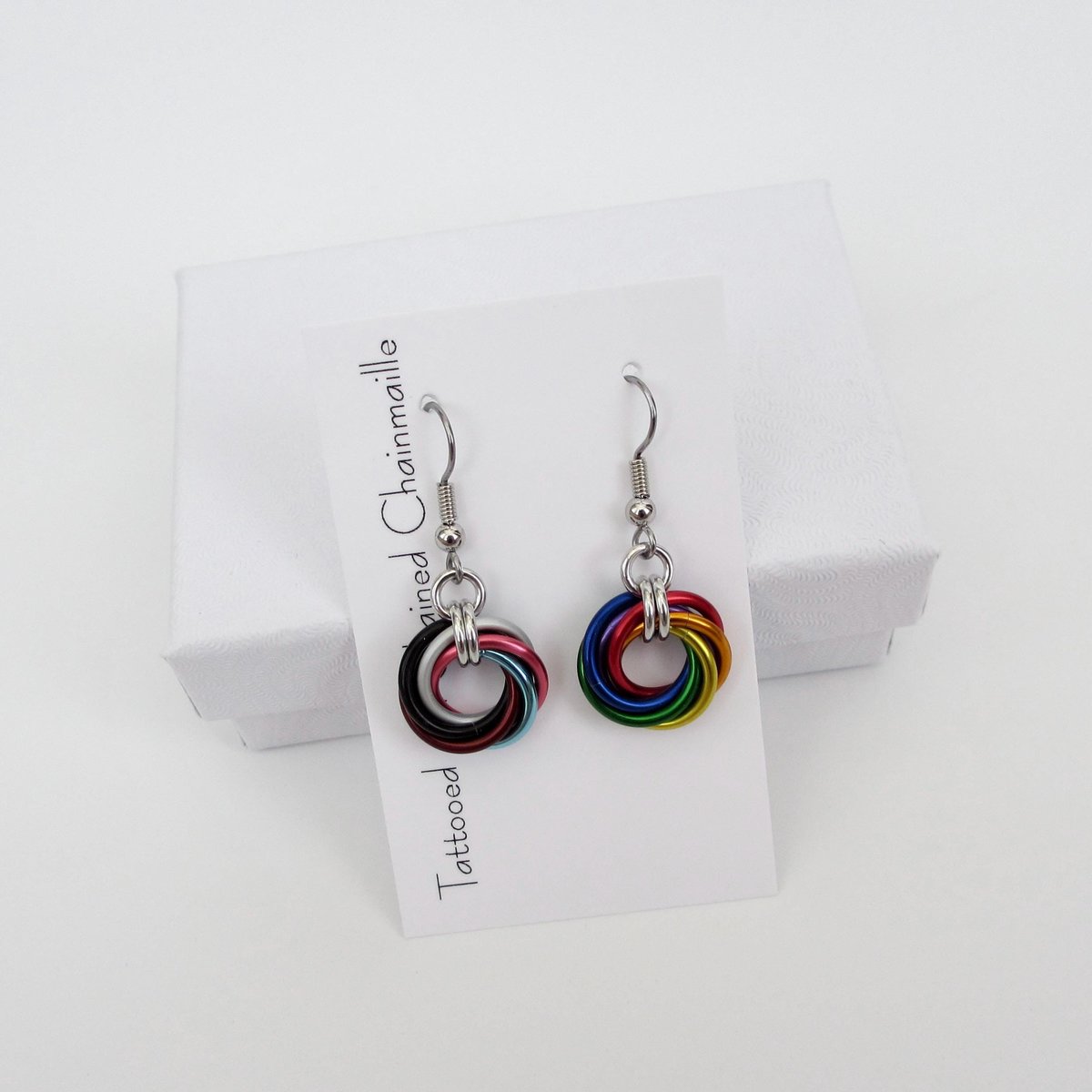 Handmade Progress Pride earrings, small love knot rainbow LGBTQ+ chainmail jewelry, inclusive pride gift