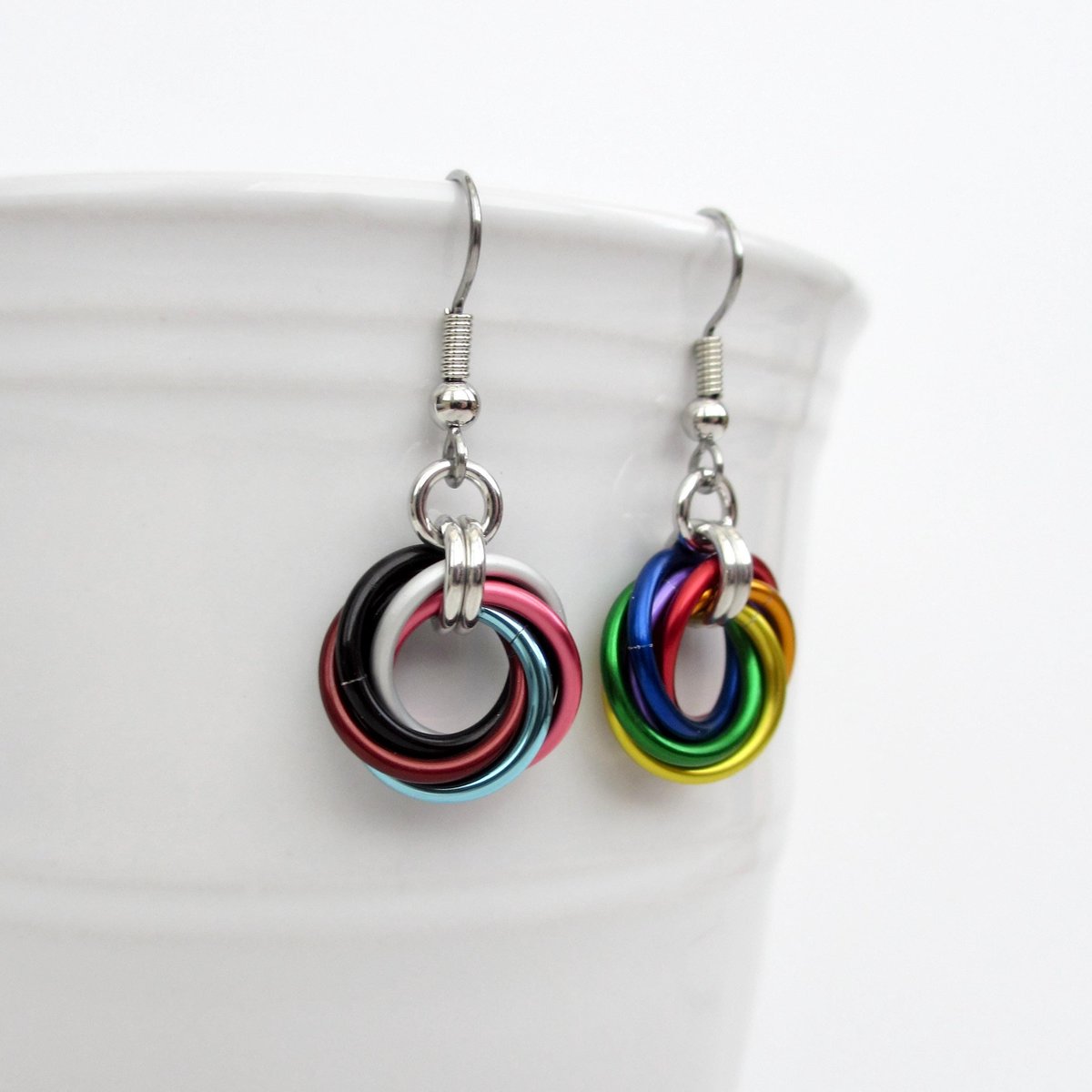 Handmade Progress Pride earrings, small love knot rainbow LGBTQ+ chainmail jewelry, inclusive pride gift