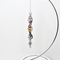Progress pride flag icicle ornament, handmade chainmail spiral in rainbow, trans, and BIPOC colors