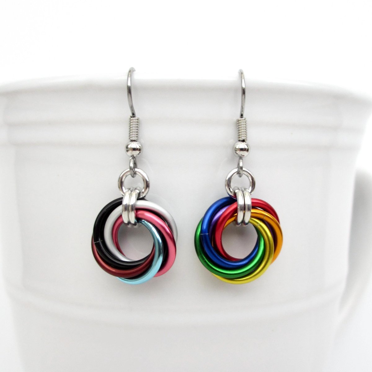 Handmade Progress Pride earrings, small love knot rainbow LGBTQ+ chainmail jewelry, inclusive pride gift