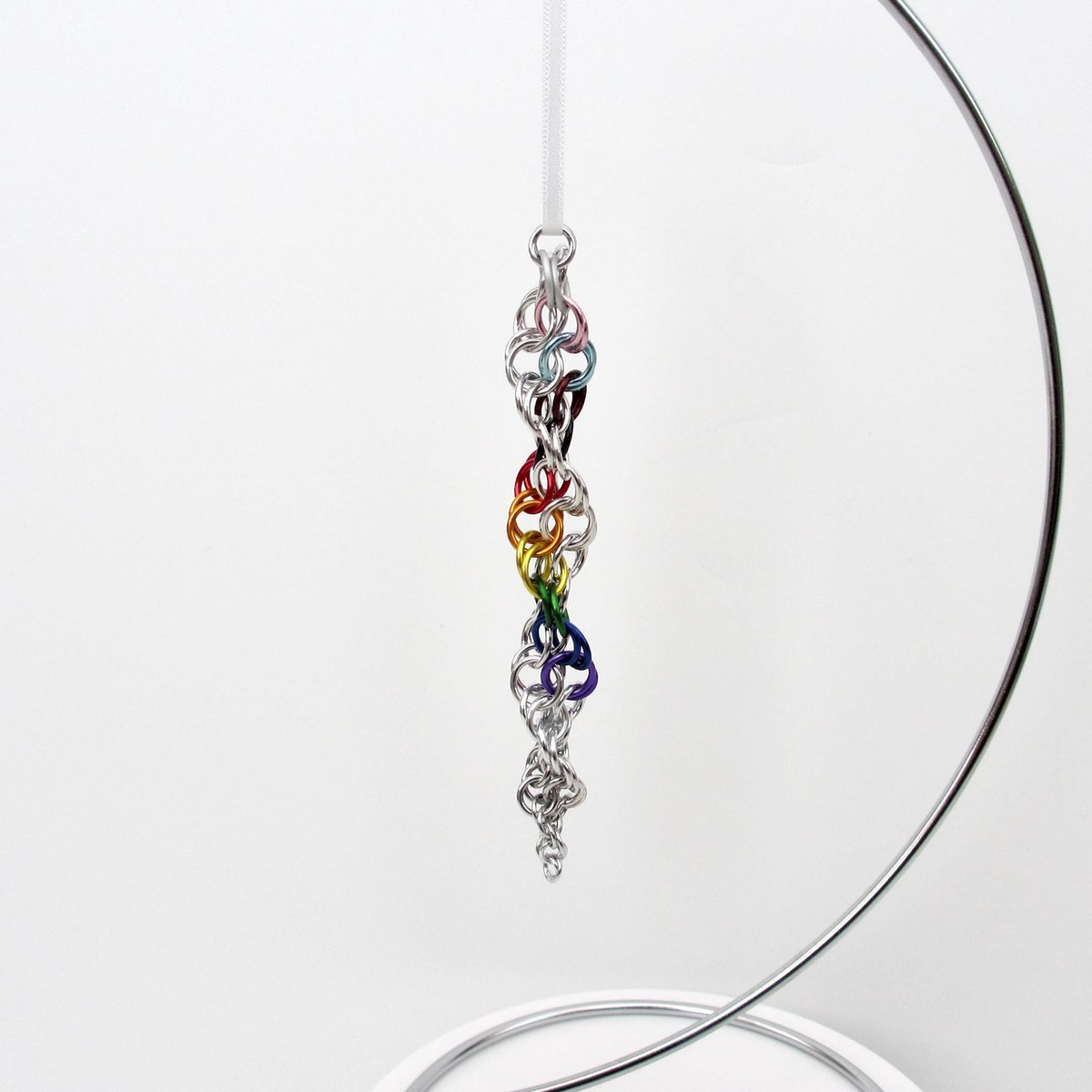 Progress pride flag icicle ornament, handmade chainmail spiral in rainbow, trans, and BIPOC colors