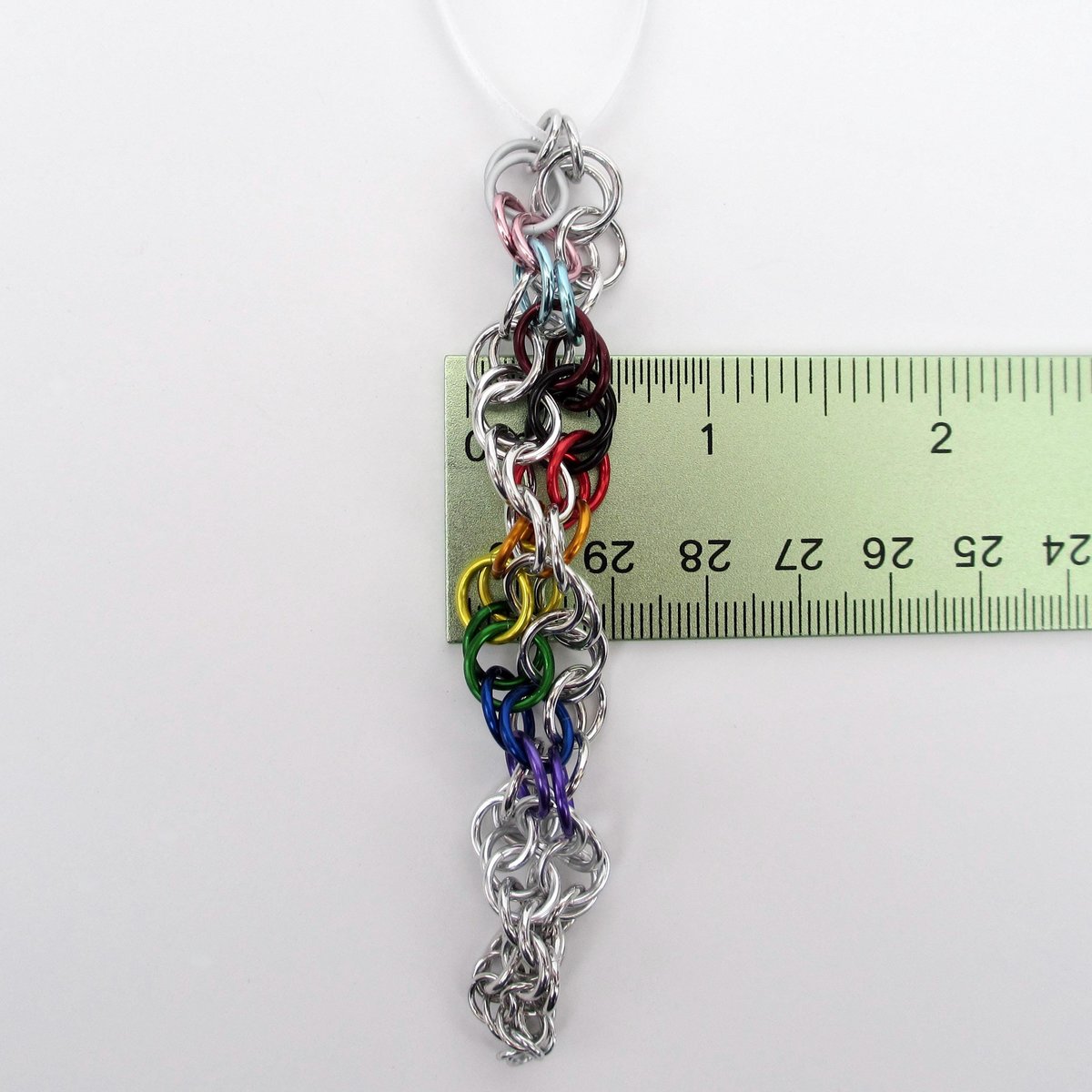 Progress pride flag icicle ornament, handmade chainmail spiral in rainbow, trans, and BIPOC colors