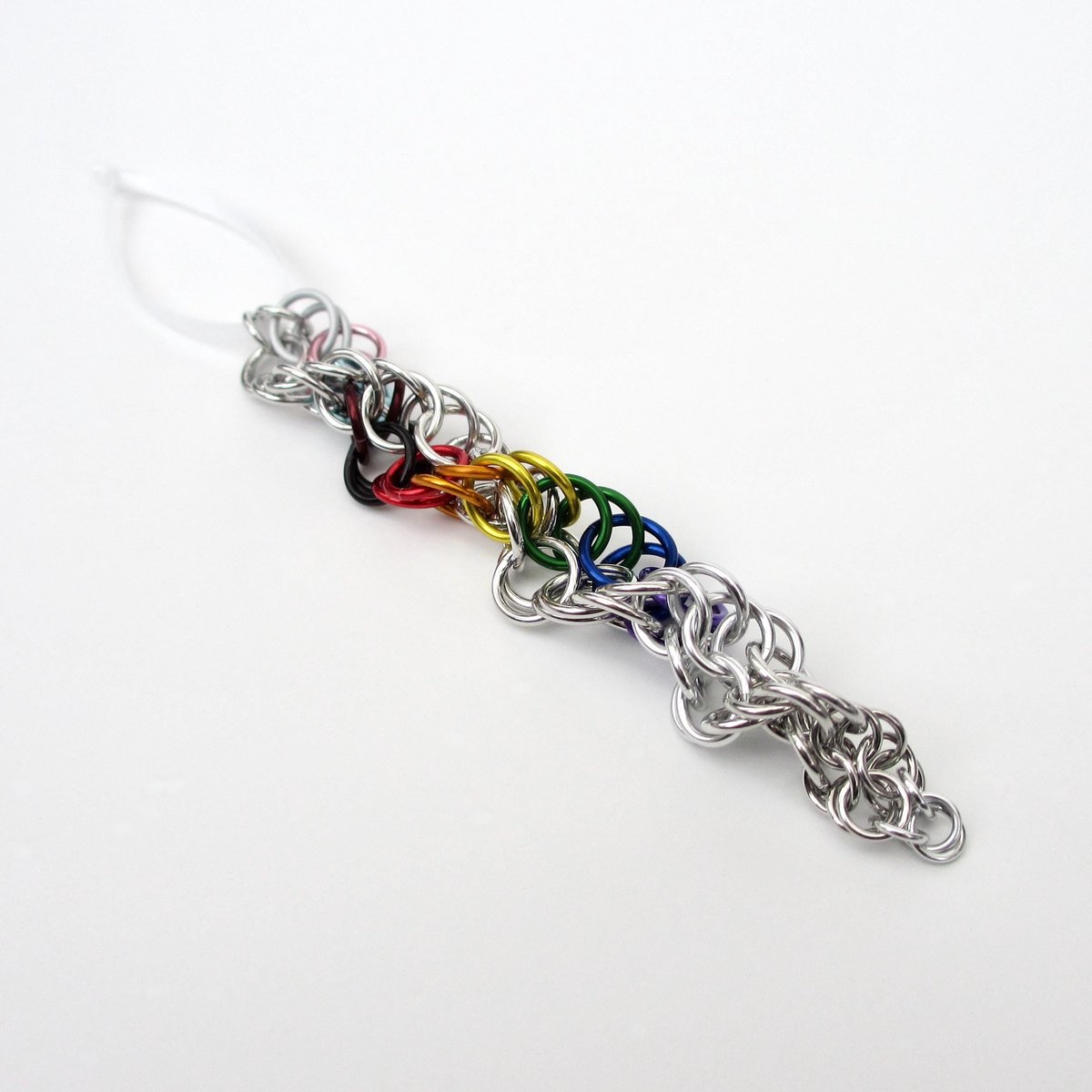 Progress pride flag icicle ornament, handmade chainmail spiral in rainbow, trans, and BIPOC colors