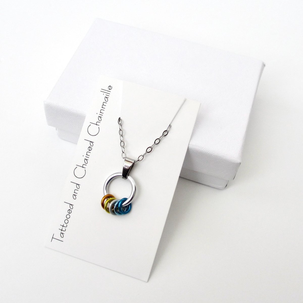 Minimalist Aroace Pride Pendant with Floating Rings in Orange, Yellow, White, Light Blue & Blue - Handmade LGBTQ+ Jewelry